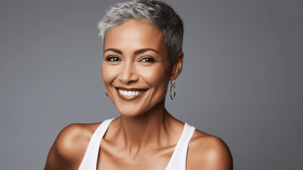 Smiling woman with glowing skin after Fractora RF Microneedling treatment for skin rejuvenation.