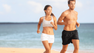 Active couple running on the beach, enjoying their toned bodies after TruSculpt iD and TruSculpt FLEX combination treatment.