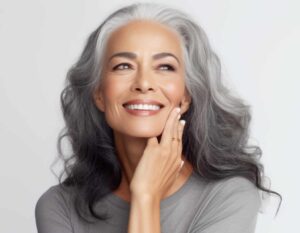 Smiling mature woman with radiant skin after Morpheus8 treatment for facial rejuvenation.