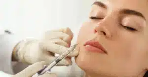woman-receiving-dermal-filler-injection-for-lips-sculpted-contours-medspa