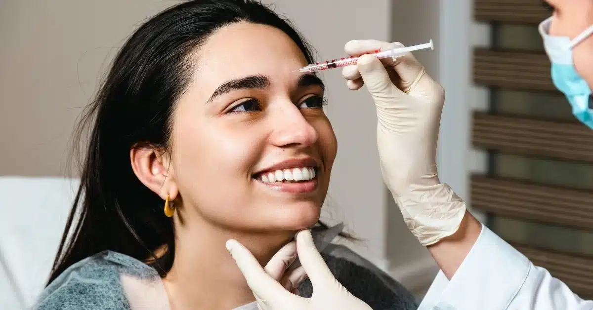 woman-getting-botox-injection-for-wrinkles-between-eyebrows