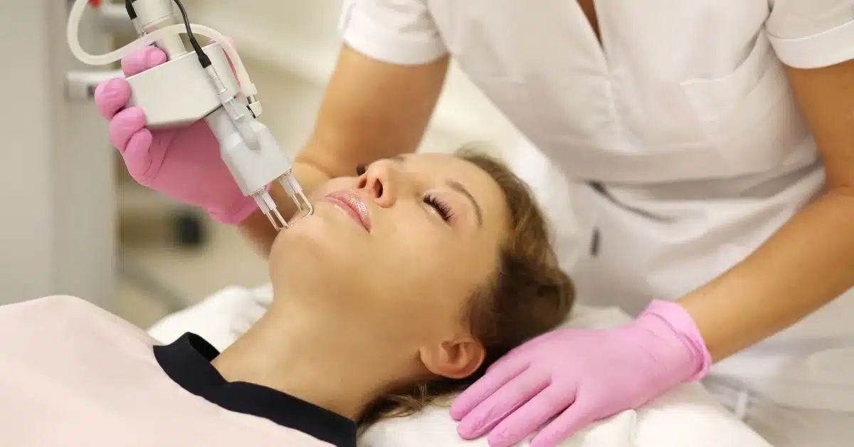 Morpheus8 treatment being applied to a woman's face for skin rejuvenation