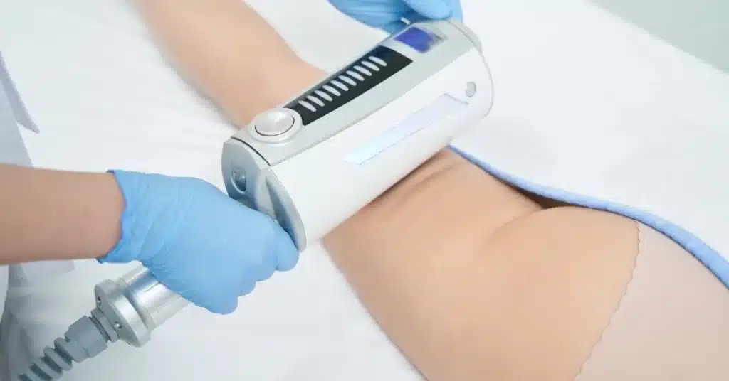 body-sculpting-treatment-being-administered-with-device-at-sculpted-contours-medspa
