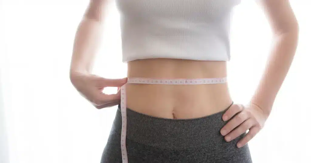 measuring-waistline-during-body-sculpting-at-sculpted-contours-medspa