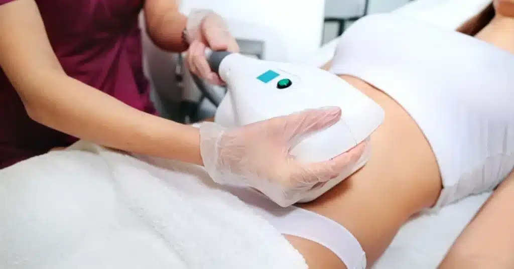body-sculpting-treatment-with-device-and-gloved-hands-at-sculpted-contours-medspa